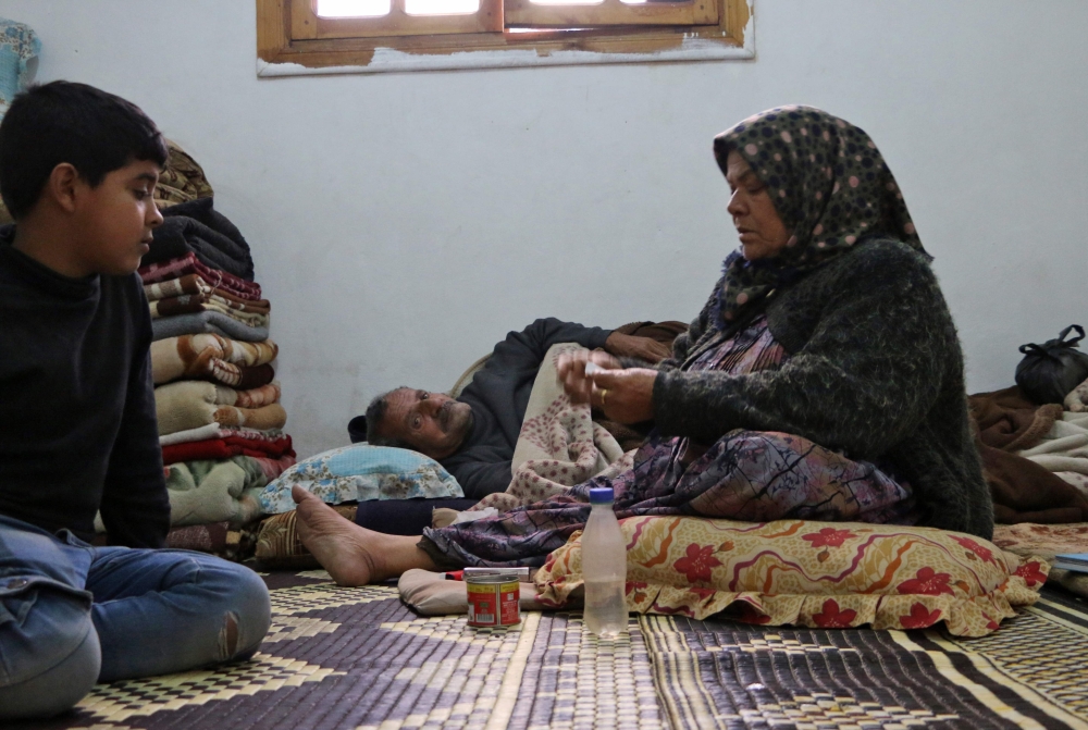 Members of seven displaced Syrian families gather in an apartment in the Kurdish Syrian town of Afrin where they are all taking shelter after fleeing from a three-week assault by Turkey and allied Syrian rebels on towns and villages along the border in northern Syria. The United Nations estimates that between 15,000 to 30,000 have been displaced by the Turkish-led offensive to other parts of Afrin district.  — AFP photos