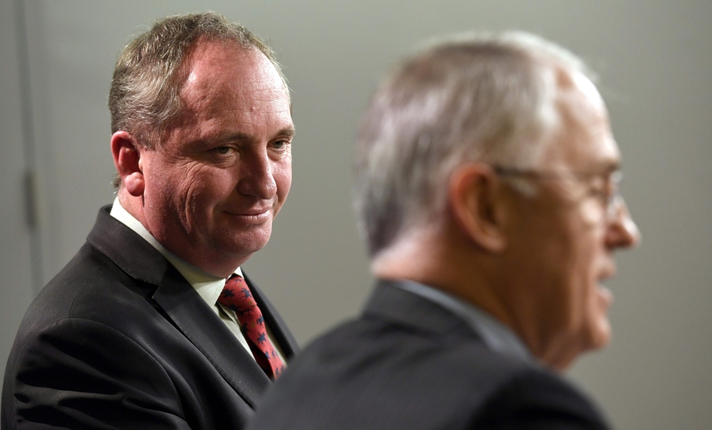 Australia’s Deputy Prime Minister Barnaby Joyce, left, looks at Prime Minister Malcolm Turnbull, right, during a press conference in Sydney in this July 5, 2016 file photo. — AFP