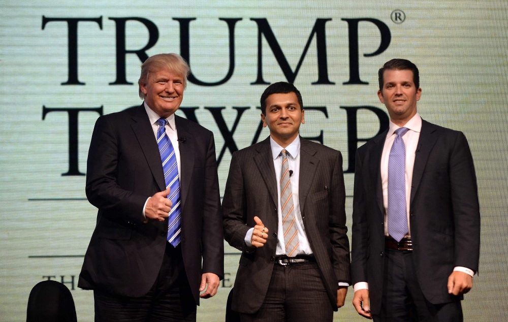 US billionaire real estate developer Donald Trump, left, — and now US president — poses for a photo with managing director of the Lodha group Abhishek Lodha, center, and Donald Trump Jr. during a news conference in Mumbai in this Aug. 12, 2014 file photo. — AFP