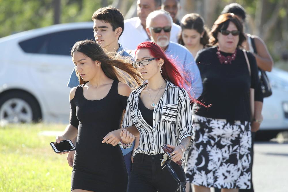 Mourners leave after attending the funeral for Scott Beigel, geography teacher from Marjory Stoneman Douglas High School, after a funeral service at Temple Beth-El on  in Boca Raton, Florida, on Sunday. — AFP