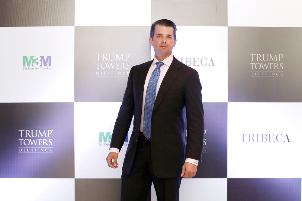 Donald Trump Jr. poses for photographers during a photo opportunity before start of a meeting in New Delhi, India, on Tuesday. — Reuters