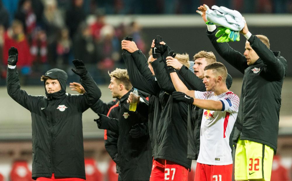 Leipzig’s players react at the end of the UEFA Europa League football match against Napoli in Leipzig Thursday. — AFP
