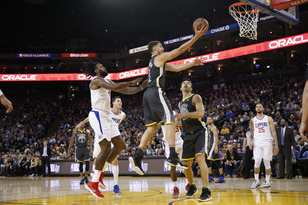Golden State Warriors’ guard Klay Thompson drives for a shot against Los Angeles Clippers during their NBA game at Oracle Arena in Oakland Thursday. — Reuters