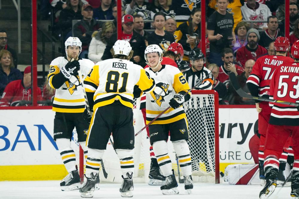 Pittsburgh Penguins’ forward Phil Kessel (C) celebrates his goal with Jake Guentzel (R) and Conor Sheary against the Carolina Hurricanes at PNC Arena in Raleigh, NC, Friday. — Reuters