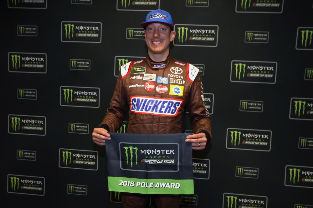 Kyle Busch, driver of the #18 Snickers Almond Toyota, poses with the Pole Award after qualifying for the pole position for the Monster Energy NASCAR Cup Series Folds of Honor QuikTrip 500 at Atlanta Motor Speedway in Hampton, Georgia, Friday. — AFP