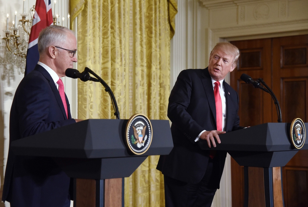 US President Donald Trump and Australian Prime Minister Malcolm Turnbull hold a joint press conference in the East Room of the White House in Washington on Friday. — AFP