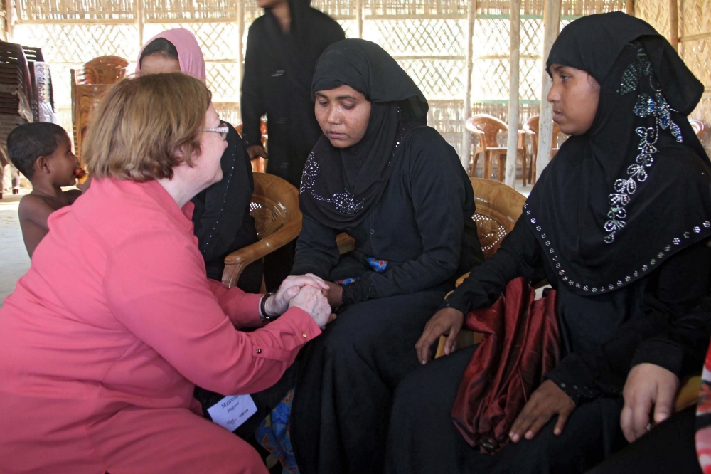 Noble Peace Laureate from northern Ireland Mairead Maguire talks with Rohingya refugees during her visit to Kutupalong refugee camp in Ukhia, Bangladesh, on Sunday. — AFP