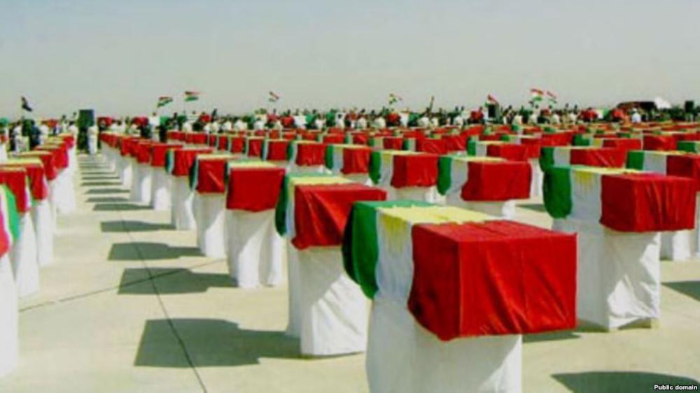 Coffins containing remains of those killed in the brutal Al-Anfal campaign. — File photo