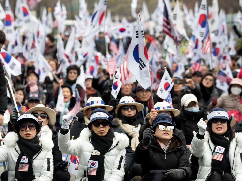 Supporters of former South Korean president Park Geun-hye protest in front of a court after prosecutors sought a 30-year jail term for the ousted president in Seoul, South Korea, on Tuesday. — Reuters