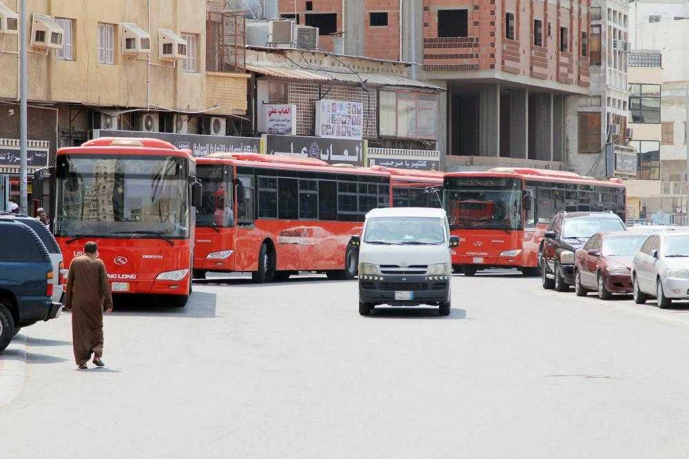 Minibuses that were put out of service remain parked in downtown Jeddah.