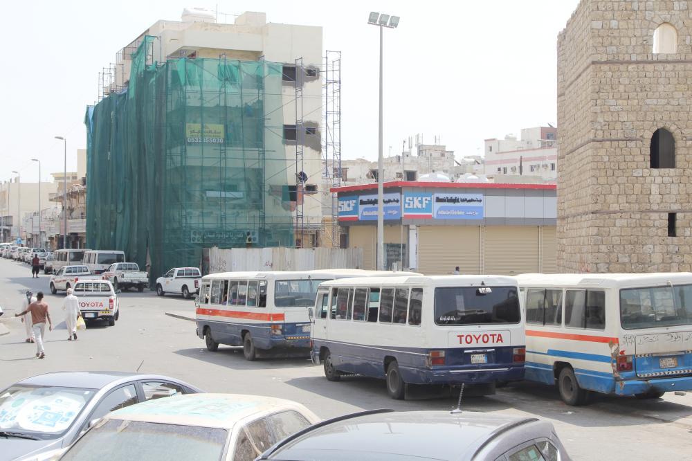 Minibuses that were put out of service remain parked in downtown Jeddah.