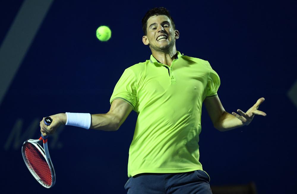 Austria’s Dominic Thiem returns the ball to Canada’s Denis Shapovalov during their Mexico ATP Tournament in Acapulco, Mexico, Wednesday. — AFP