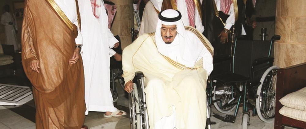 Custodian of the Two Holy Mosques King Salman using a wheelchair through an accessibility obstacle course.