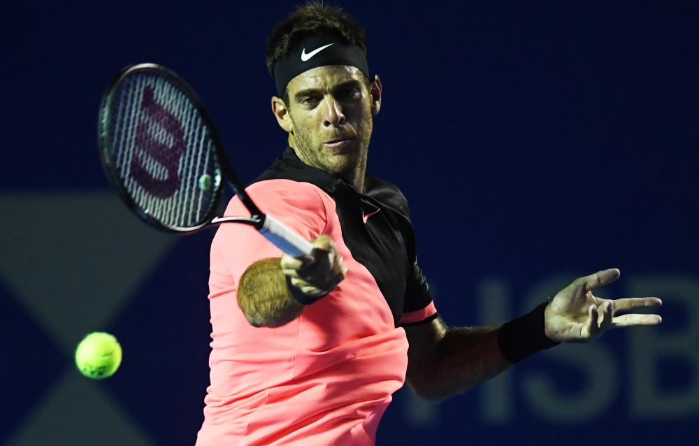 Argentina’s Juan Martin del Potro returns the ball to Austria’s Dominic Thiem during their Mexico ATP 500 Open Tennis Tournament in Acapulco Thursday. — AFP