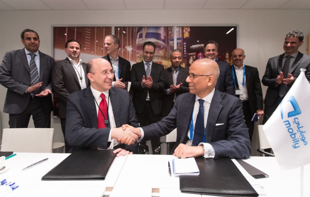  Eng. Ahmed Aboudoma, Mobily CEO, and Ashish Chowdhary, Chief Customer Operations Officer at Nokia, shake hands after signing the MoU in Barcelona
