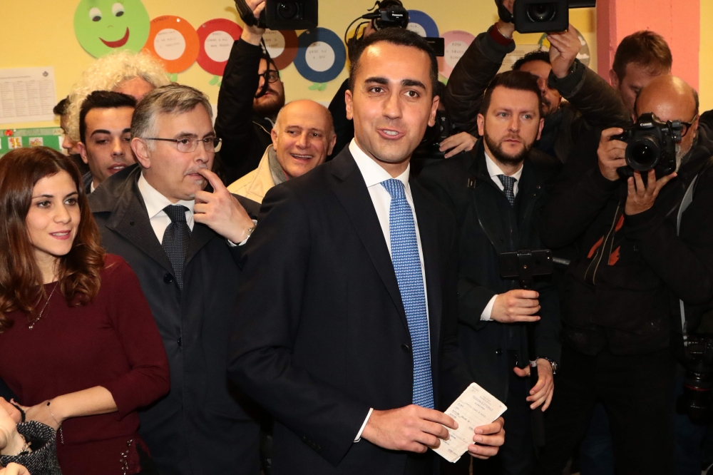Italy’s populist Five Star Movement (M5S) party leader Luigi Di Maio arrives to vote on Sunday at a polling station in Naples. — AFP