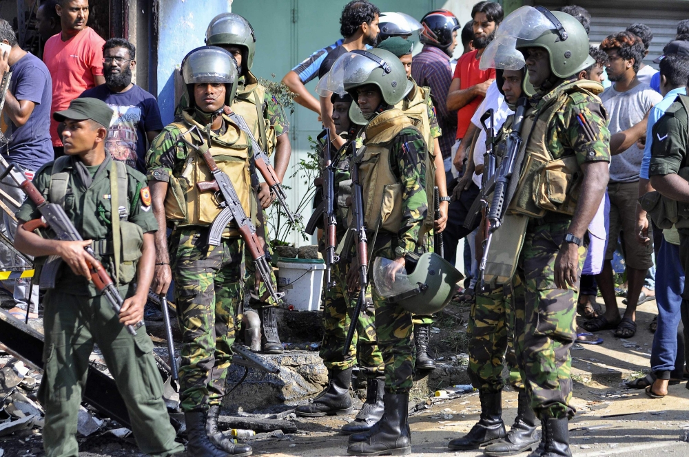 Sri Lankan police commandos patrol on the streets of Pallekele, a suburb of Kandy, on Tuesday, following anti-Muslim riots that has prompted the government to declare a state of emergency. — AFP