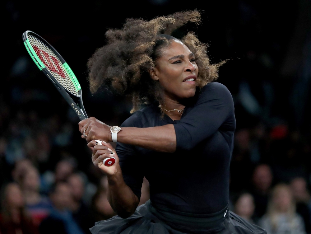 Serena Williams of the United States returns a shot to Shuai Zhang of China during the Tie Break Tens at Madison Square Garden on Monday in New York City. — AFP