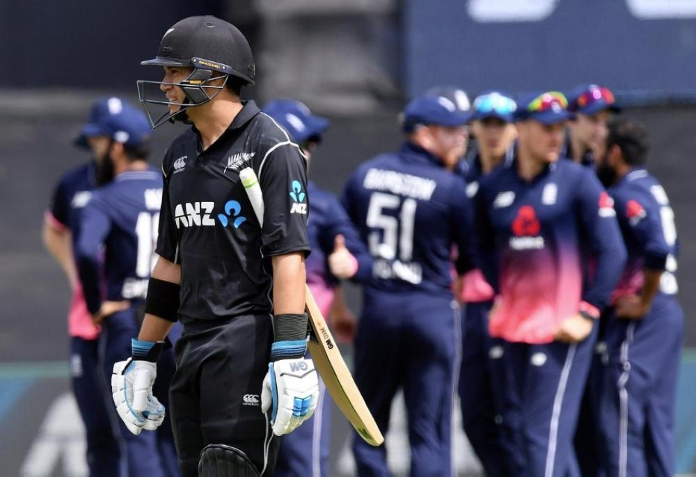 New Zealand's Ross Taylor reacts as he walks off the ground as England players celebrate during their One-Day International match at Bay Oval, Tauranga, New Zealand. — Reuters