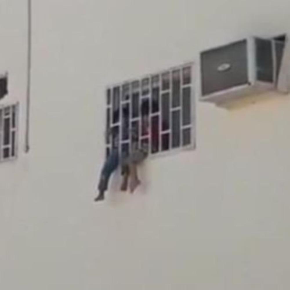 Two children clinging to the window of their room as shown in a video that went viral on social media.