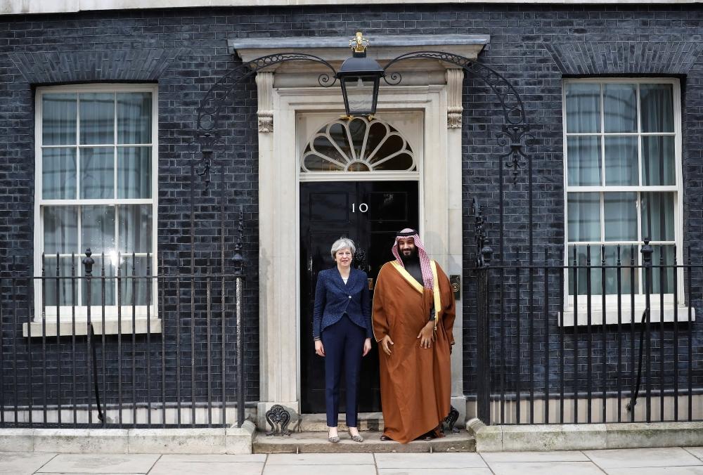 British Prime Minister Theresa May and Crown Prince Muhammad Bin Salman hold a meeting with other members of the British government and Saudi ministers and delegates inside number 10 Downing Street in London on Wednesday. — Reuters