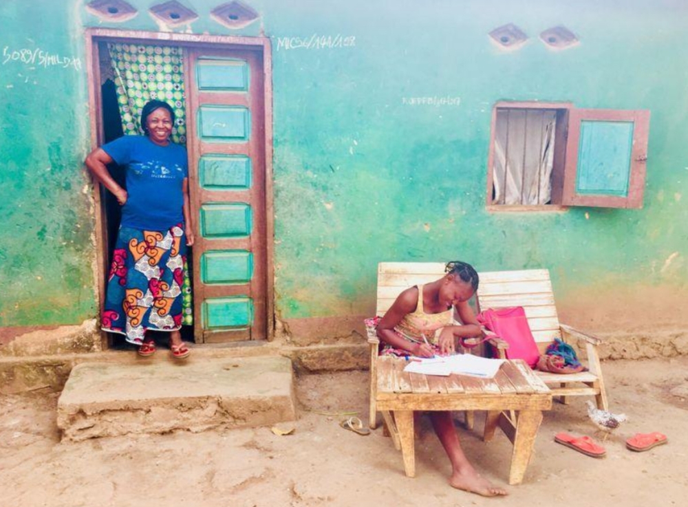 A mother supervises her teenage daughter doing biology homework in Bangui, Central African Republic. — Thomson Reuters Foundation
