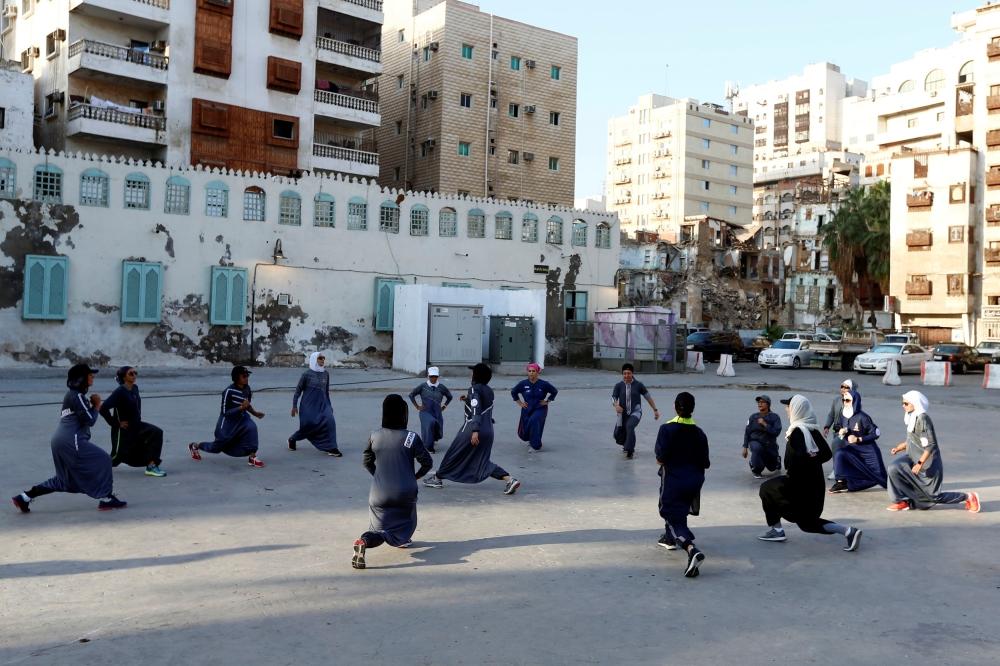 Women cheer during a running event marking International Women's Day in Old Jeddah, Saudi Arabia March 8, 2018. — Reuters