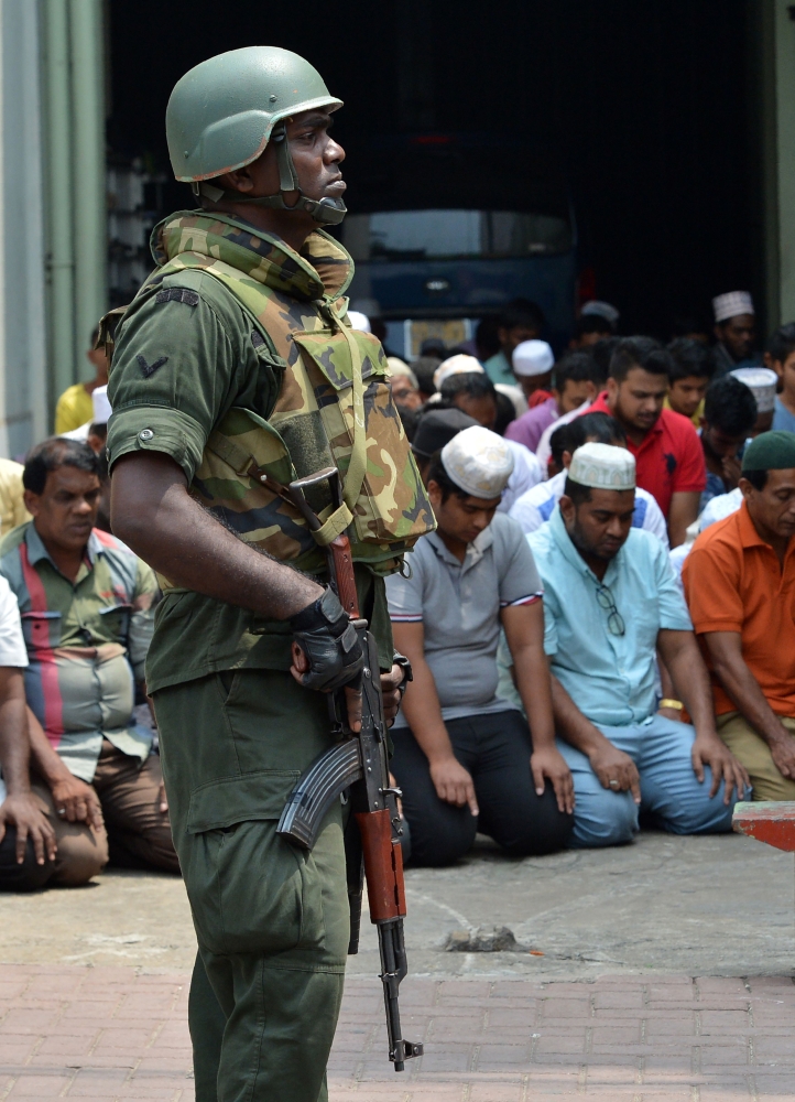 A Sri Lankan army soldier guards a mosque in Sri Lanka’s capital Colombo on Friday. — AFP