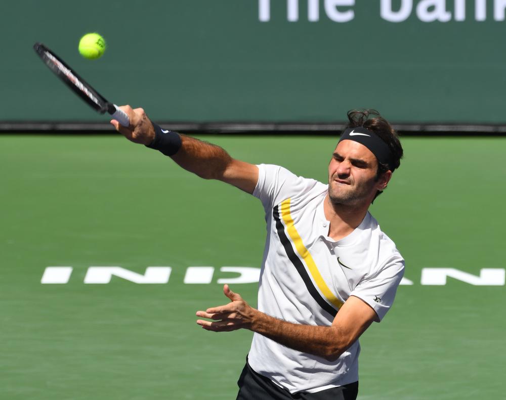 Roger Federer of Switzerland serves against Filip Krajinovic at the BNP Paribas Open in Indian Wells Monday. — Reuters