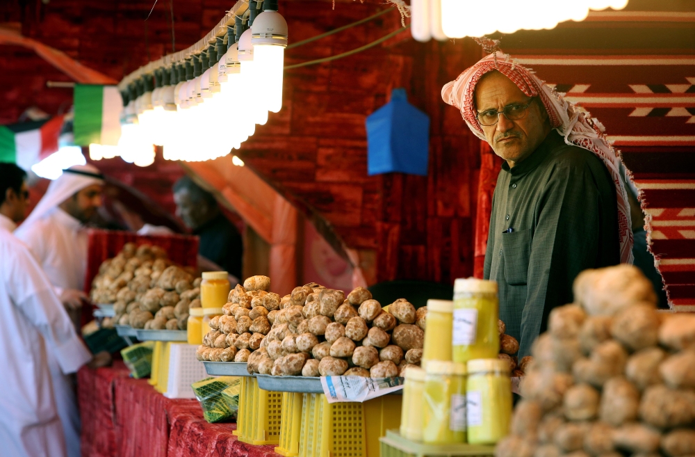 A Kuwaiti vendor stands behind his truffles for sale at a market in Al-Rai, an industrial zone northwest of Kuwait City in this March 1, 2018 file photo. — AFP