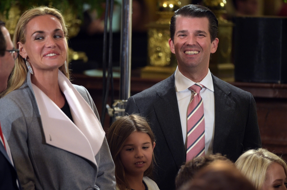 Donald Trump, Jr., right, his wife Vanessa, left, and their daughter Kai, center, attend the White House senior staff swearing in at the White House on Jan. 22, 2017, in Washington. — AFP