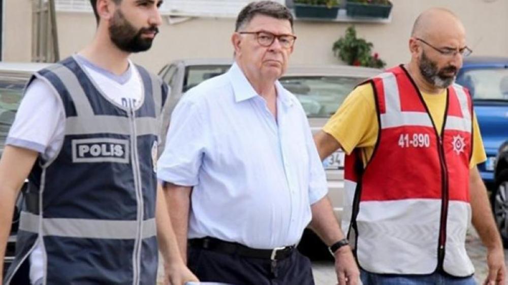 Sahin Alpay (center) being escorted to the court. — File photo