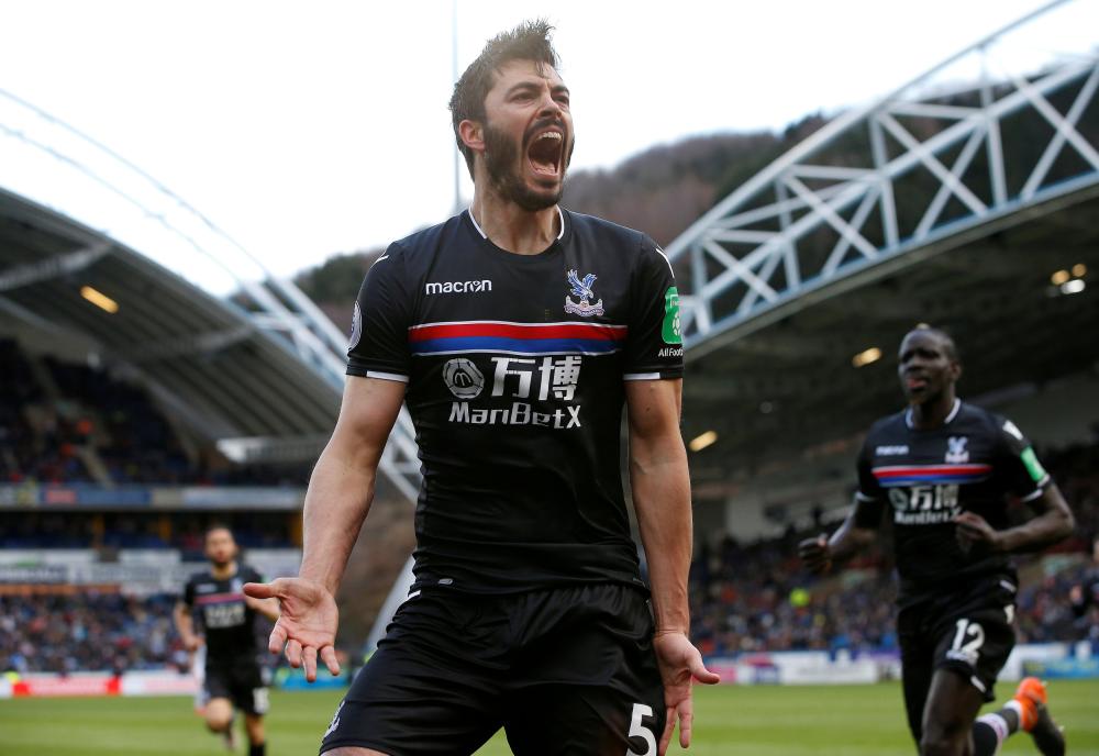 Crystal Palace's James Tomkins celebrates scoring against Huddersfield Town  during their Premier League match at John Smith's Stadium, Huddersfield, Saturday. — Reuters