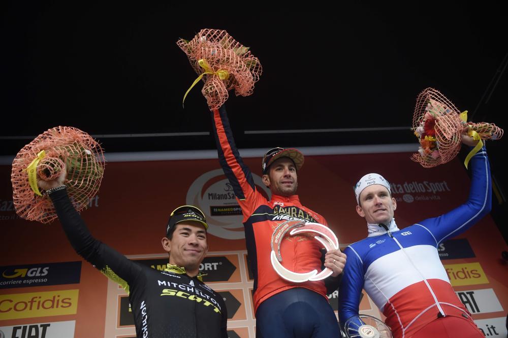 Italy’s Vincenzo Nibali (C) of team Bahrain, winner, poses on the podium with Australian Caleb Ewan (L) of team Mitchelton Scott, second, and France’s Arnaud Demare of team Groupama FDJ, third, on the podium of the 109th Milan-San Remo cycling race Saturday. — AFP