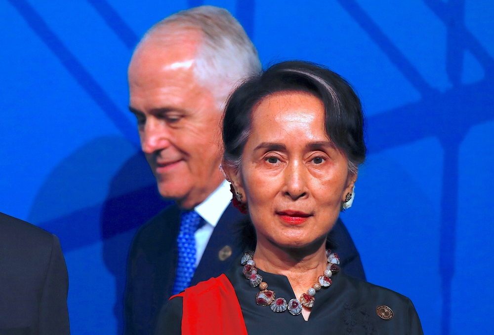 Australian Prime Minister Malcolm Turnbull walks behind Myanmar State Counselor Aung San Suu Kyi during the Leaders Welcome and Family Photo at the one-off summit of 10-member Association of Southeast Asian Nations (ASEAN) in Sydney, Australia, on Saturday. — Reuters