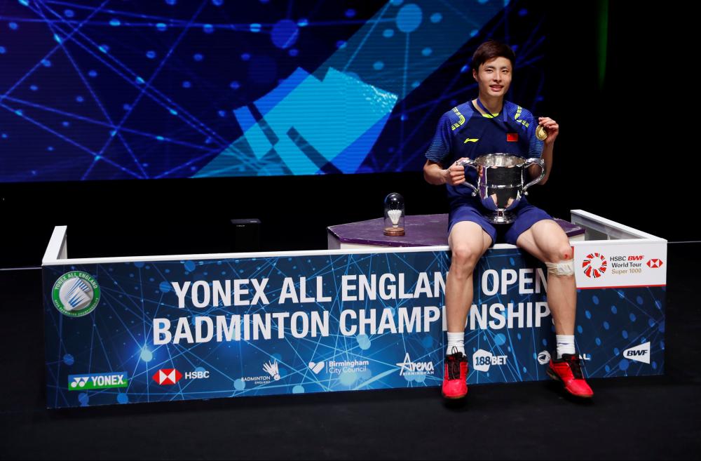 China's Shi Yuqi celebrates victory in the men's singles final of the Yonex All England Open Badminton Championships at Arena Birmingham Sunday. — Reuters