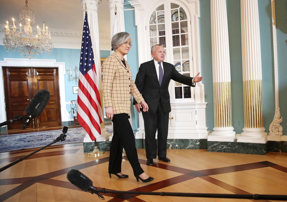 US Deputy Secretary of State John Sullivan escorts South Korean Foreign Minister Kang Kyung-wha prior to a meeting at the State Department  in Washington in this March 16, 2018 file photo. — AFP