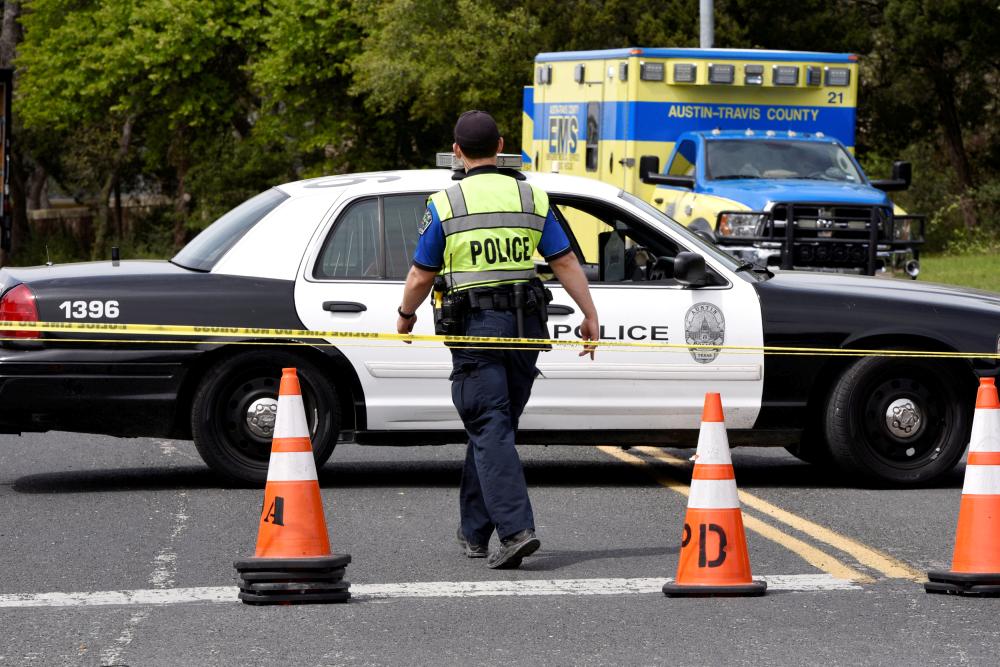 Members of Austin Police Department block off part of Republic of Texas Boulevard following an explosion in Austin, Texas, on Monday. — Reuters