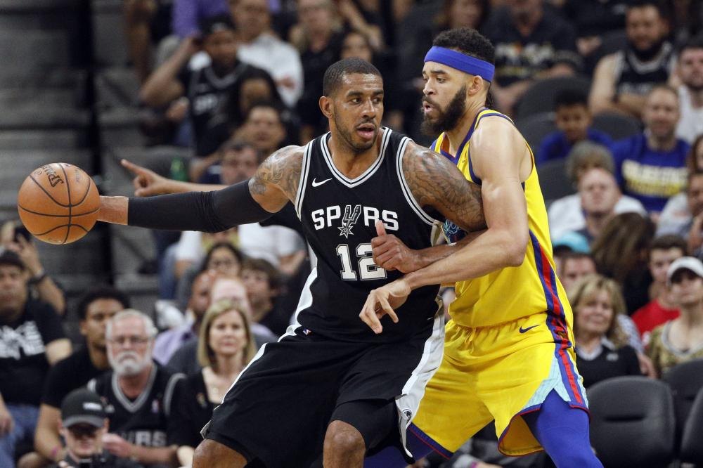 Mar 19, 2018; San Antonio, TX, USA; San Antonio Spurs power forward LaMarcus Aldridge (12) posts up against Golden State Warriors center JaVale McGee (right) during the second half at AT&T Center. Mandatory Credit: Soobum Im-USA TODAY Sports