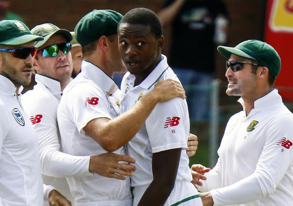 South Africa’s bowler Kagiso Rabada (2nd R) celebrates a wicket with teammates during the second cricket Test match against Australia at St George's Park in Port Elizabeth on  March 9, 2018. — AP 