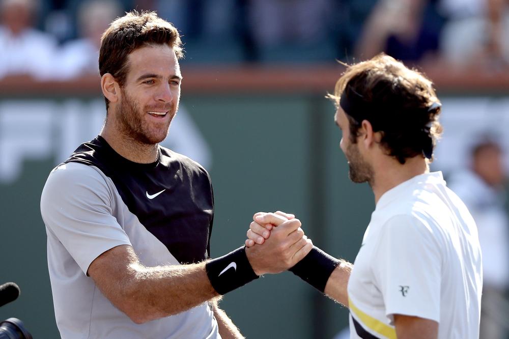 Juan Martin Del Potro of Argentina is congratulated by Roger Federer of Switzerland after their final at the BNP Paribas Open in Indian Wells Sunday. — AFP