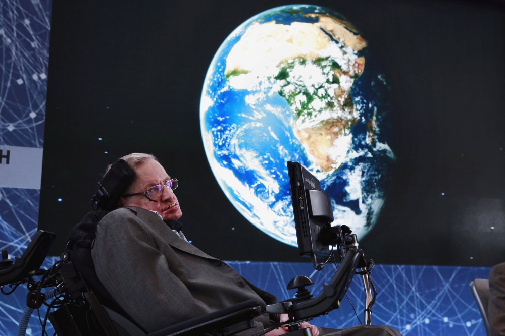 Physicist Stephen Hawking sits on stage during an announcement of the Breakthrough Starshot initiative with investor Yuri Milner in New York in this April 12, 2016 file photo. - Reuters