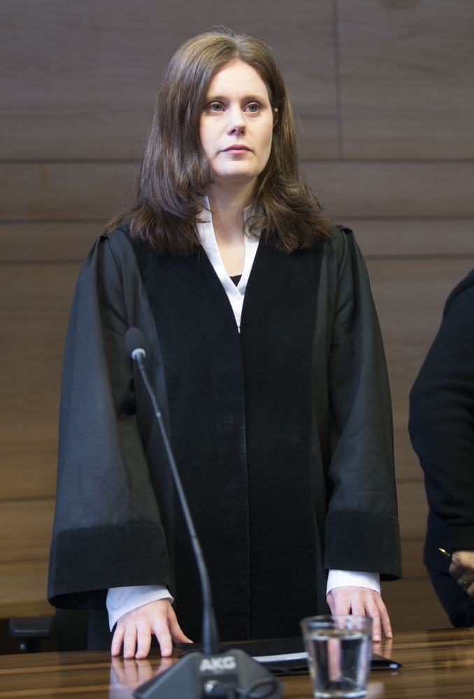 Presiding judge Kathrin Schenk stands in the courtroom before she proclaims the sentence in the trial against Hussein K, who is accused of raping and killing a young woman in October 2016, at the regional court in Freiburg, southern Germany, on Thursday. — AFP