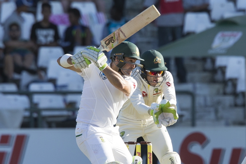 Dean Elgar of South Africa smashes the ball for four during the first day of the third cricket Test match between South Africa and Australia at Newlands Stadium, in Cape Town, South Africa, Thursday. — AP