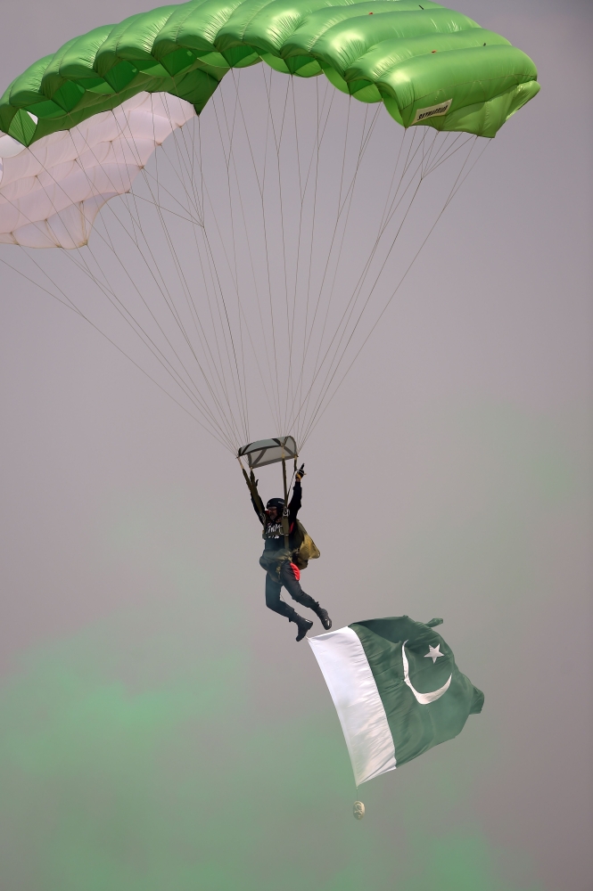 A Pakistani camel-mounted military band performs during a Pakistan Day military parade in Islamabad on Friday. — AFP