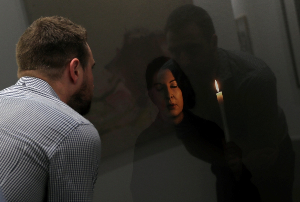 Visitors look at artworks at the annual Art Dubai exhibition in Dubai on Wednesday. — Reuters