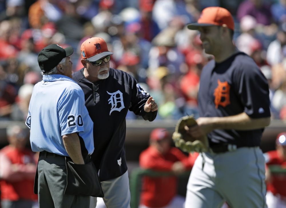 Detroit Tigers manager Ron Gardenhire, center, argues with home plate umpire Tom Hallion, left, as starting pitcher Matthew Boyd leaves the field after Boyd was ejected for hitting Philadelphia Phillies' Odubel Herrera during the fifth inning of a spring training baseball game Thursday in Clearwater, Fla. — AP