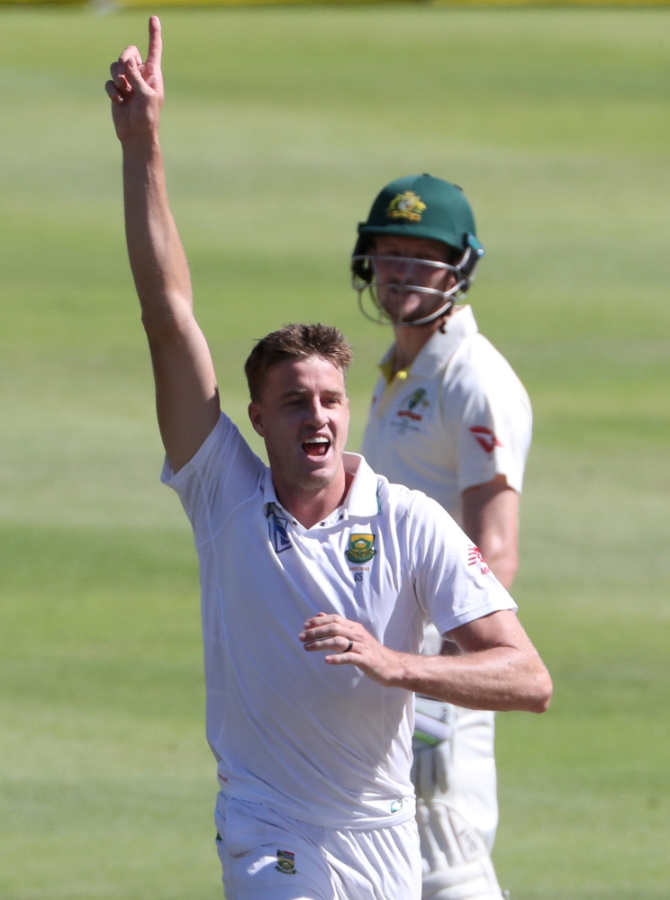 South Africa's Morne Morkel celebrates taking the wicket of Australia's Shaun Marsh at the Newlands Test in Cape Town on Friday. — Reuters