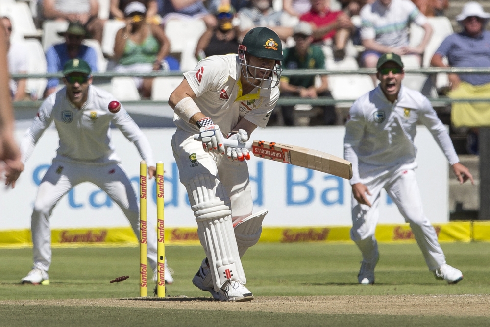 David Warner is bowled by Kagiso Rabada on the second day of the third cricket Test between South Africa and Australia at Newlands Stadium, in Cape Town, South Africa, Friday. — AP