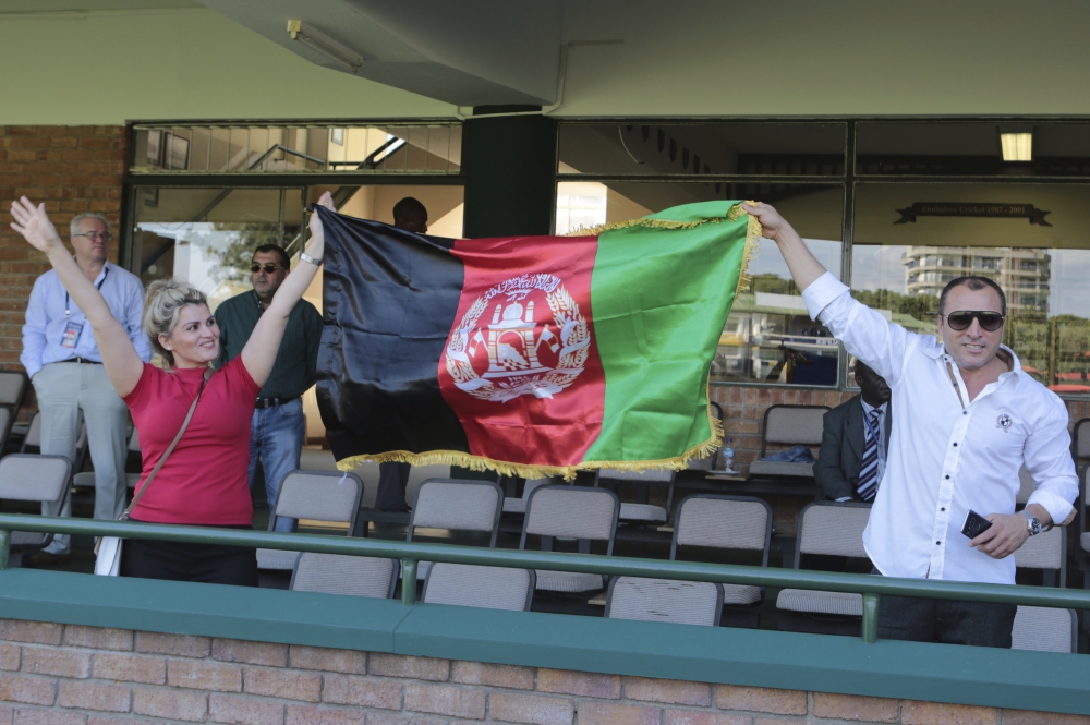 Afghanistan players celebrate after beating Ireland to qualify for the Cricket World Cup after their match at Harare Sports Club, Friday. — AP